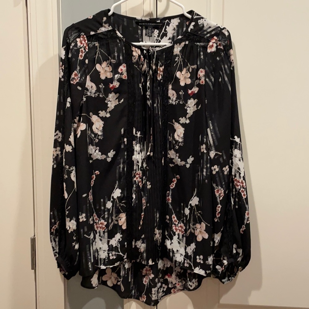 Black shirt with white and pale pink.